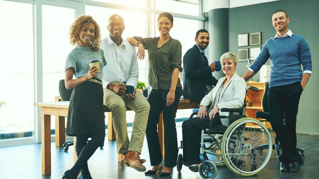 Diverse team of business professionals, one in wheelchair